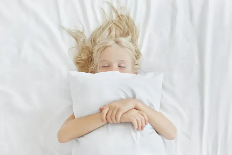 carefree-restful-little-girl-lying-white-bedclothes-embracing-pillow-while-having-pleasant-dreams-blonde-girl-with-freckles-sleeping-bed-after-spending-all-day-picnic-restful-child_273609-267-1